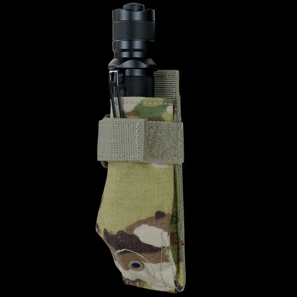 A black flashlight is secured in the Condor i-Pouch - Scorpion OCP, featuring a Scorpion OCP camouflage design with a Velcro strap and a metal clip on the side.